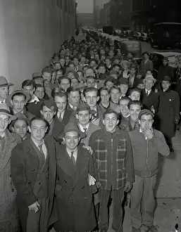 Prints of (Original Caption). Hundreds of young men turned up at 90 Church Street to volunteer in the Navy and Marine branches on the day following the Japanese bombing of Pearl Harbor Pearl Harbor Prints: Large Crowd of Prospective Military Recruits Standing in Street