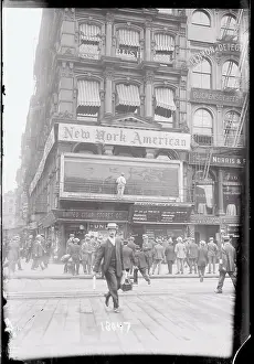 Enthusiasm Prints: Large Crowd Reading Electronic News on Building