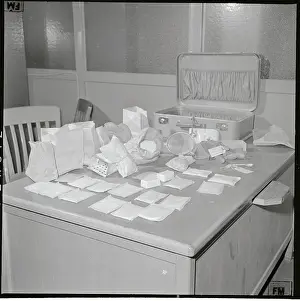 Edward F Prints: Large Drug Bust Displayed on Desk