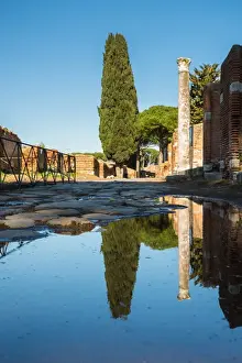 Ruined City Prints: A large puddle in the ruins of the Ancient Roman harbour city of Ostia Antica in Rome