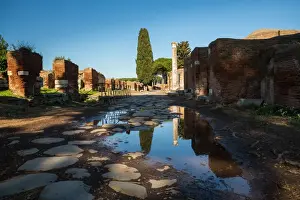A large puddle in the ruins of the Ancient Roman harbour city of Ostia Antica in Rome, Italy