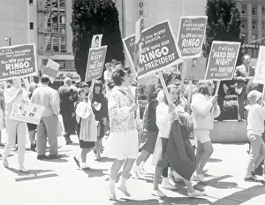 Large Young Crowd Carrying Signs