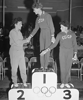 Prints of (Original Caption). Top Women Gymnasts Flips of History: Larisa Latynina congratulates Agnes Keleti and Sofi Mouratova
