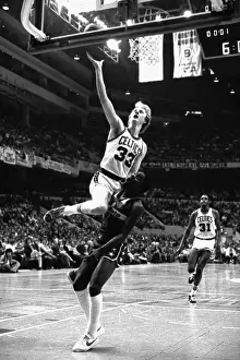Larry Bird Climbing on Player to Score
