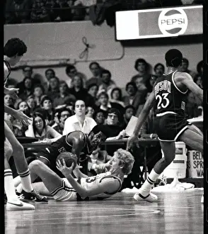 Larry Bird Lying on the Floor During Basketball Action