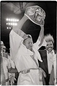 Larry Holmes Holding IBF Championship Belt