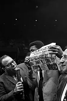 LAS VEGAS, NV - JULY 22: Heavyweight contender Cassius Clay (later known as Muhammad Ali) attempts to get to the ring to taunt Sonny Liston who has just defeated former champion Floyd Patterson to retain his heavyweight crown) on July 22