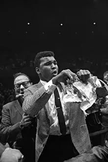 LAS VEGAS, NV - JULY 22: Heavyweight contender Cassius Clay (later known as Muhammad Ali) attempts to get to the ring to taunt Sonny Liston who has just defeated former champion Floyd Patterson to retain his heavyweight crown) on July 22