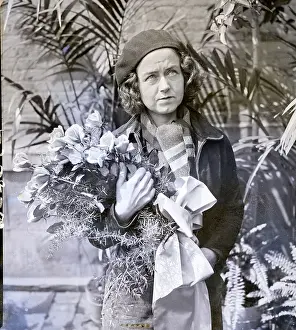 Laura Ingalls Standing Holding Flowers