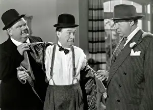 Prints of (Original Caption). Stan Laurel and Oliver Hardy being held at knife point by a thief in a scene from The Bullfighters. A Twentieth Century Fox Picture Timeless Comedy Icons: Classic Moments from the Legendary Duo: Laurel And Hardy In Movie Still