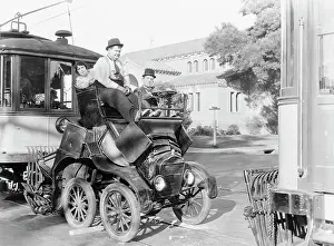 Prints of (Original Caption). Laurel and Hardy in automobile mishap Timeless Comedy Icons: Classic Moments from the Legendary Duo: Laurel and Hardy Smashing Auto