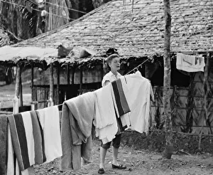 Lauren Bacall Hanging Clothes on Clothesline