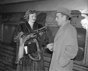 Lauren Bacall and Humphrey Bogart Standing by Train