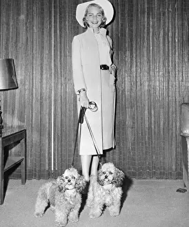 Lauren Bacall Posing with Two Dogs
