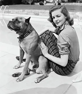 Lauren Bacall Seated W/Dog Poolside
