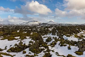 Images Dated 14th March 2015: Lava rocks with the snowy mountain, Iceland
