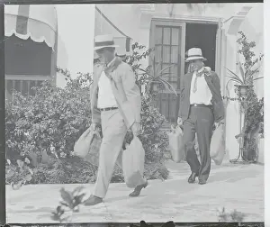 Exiting Prints: Law Enforcement Officers Carrying Bags from Al Capone's Home