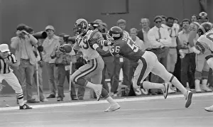 Lawrence Taylor Being Stopped by Eric Dickerson in Football Play