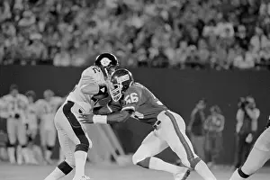 Lawrence Taylor Stopping Terry Bradshaw in Football Play