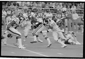 Lawrence Taylor Stopping Tommy Krammer During Football Game