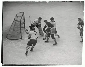Prints of (Original Caption). On a pass from Neil Colville, Lynn Patrick of the New York Rangers rams the puck home for a score against the Toronto Maple Leafs at Madison Square Garden. Goalie Walter (Turk) Frozen Moments: A Journey Through Hockey History: Leafs and Rangers Hockey Players in Action