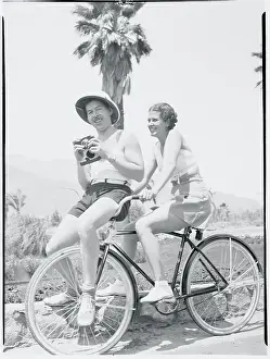 Leah Ray and Jimmy Starr Riding Bicycle