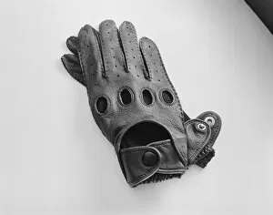 Leather gloves on white background, close-up