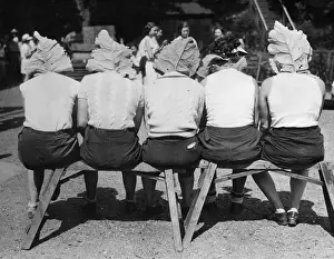 Prints of 11th July 1935: Members of a womens rowing team using large leaves to keep the sun off the back of their necks. (Photo by Fox Photos/Getty Images) Timeless Treasures: Iconic Black and White Prints from the Fox Photo Library: This Leaves Us Cool