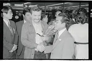 Lech Walesa and Motofumi Kakieda Shaking Hands