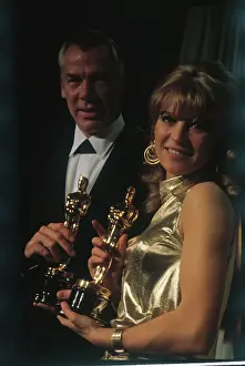 Lee Marvin and Julie Christie Holding Their Oscar Awards