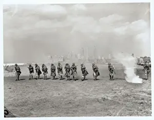 Legionnaires Acting out Capture of Fleville with NYC Background