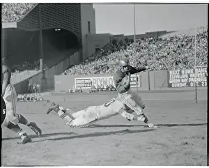 Len Ford Tackling His Opponent
