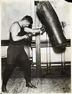 Gymnasium Prints: Full Length Jess Willard Punches Bag