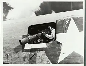 Guadalcanal Prints: Lens Aerial Camera Being Used on Reconnaissance Squadron Based on Guadalcanal