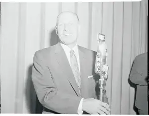 Leo Durocher Speaking into a Microphone