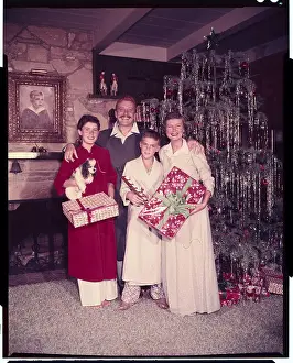 Leon Ames and Family Posing with Christmas Gifts