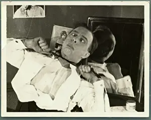 Leslie Henson Tying a Bow Tie