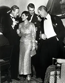 Prints of (Original Caption) 1/7/1933-Hollywood, CA-: Leslie Howard, Norma Shearer A Timeless Christmas: Vintage Treasures: Leslie Howard, Norma Shearer, Gary Cooper and Lionel Barrymore