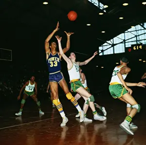 Lew Alcindor Hanging from Basketball Rim