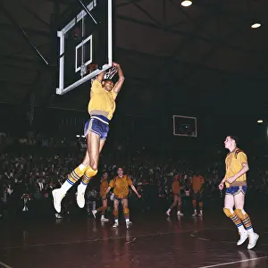 Lew Alcindor Tries to Catch Airborne Basketball