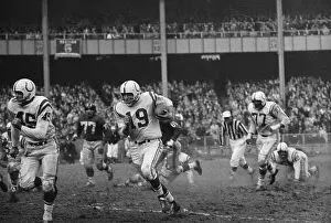 L.G. Dupre and Johnny Unitas in football game