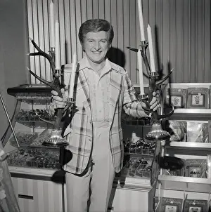 Liberace Admiring Antler Candelabra