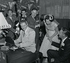 Liberace and His Brother Serenading
