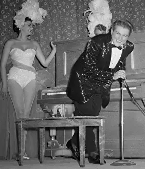 Liberace with Showgirls During Performance in Las Vegas