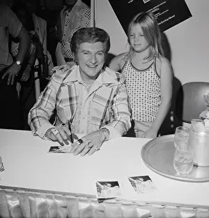 Liberace Prints: Liberace Signing Autographs