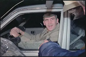 Lieutenant Colonel Oliver North Speaking to Reporters from Limousine