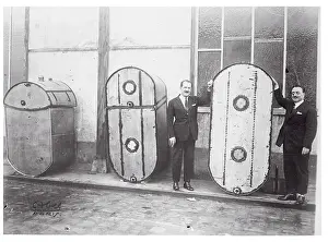 Lieutenants Tarascon and Coli Standing Next to Gasoline Tanks