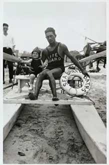 Life Guard Posing with Infant