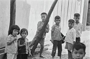 Prints of A group of Vietnamese children on a street in Saigon, Vietnam, 30th August 1965. In 1976, Saigon was officially renamed Ho Chi Minh City to commemorate the first leader of North Vietnam, Ho Chi Minh Vietnam Prints: Life In Saigon