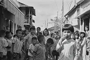 Prints of Vietnamese children on a rundown street in Saigon, Vietnam, 30th August 1965. In 1976, Saigon was officially renamed Ho Chi Minh City to commemorate the first leader of North Vietnam, Ho Chi Minh Vietnam Prints: Life In Saigon